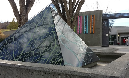 "We Are Here" granite pyramid at the Muttart Conservatory's entrance.