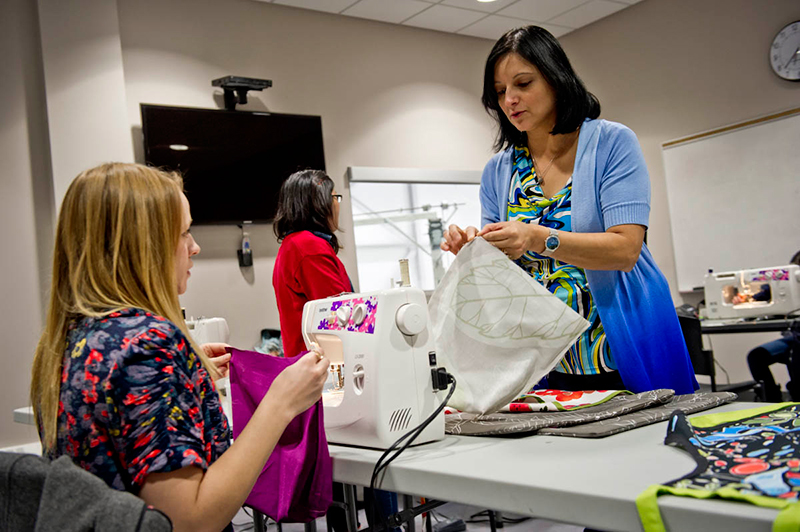 women in sewing class